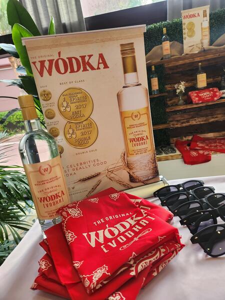 Wodka display with award medals and branded merch at Tiki-A-Go-Go