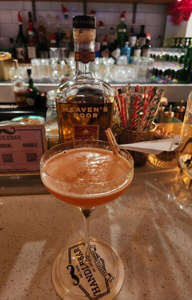 Heaven's Door cocktail with paper-plane garnish at The Handlebar, Mount Dora